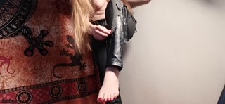 Topless beauty pisses through her ruined leather trousers