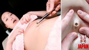 Oiled on the table, Maiko Kobayashi exposes her belly button… and what gets extracted smells like rotting fetish [Part 2]