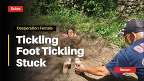 Buried in the sand with something written on her feet and being tickled (CC3)