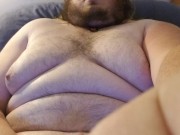 Chubby guy blows huge load on himself.