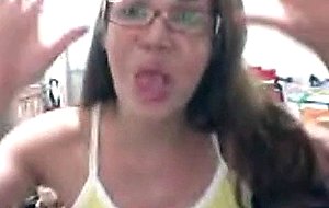 Cute brunette in yellow teasing on cam