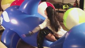 Mishel riding on a big blue dolphin