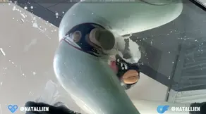 Latex-clad Natallien humiliates and fucks her girlfriend in a rubber catsuit