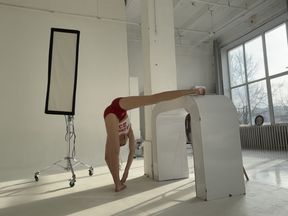 GYM flexible girl in red shorts
