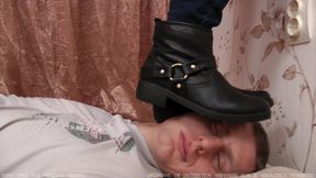 Lady introduces leather boots to man`s face and chest (0655, 720p)