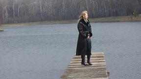 Bitch in leather pissing on a pier