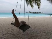 Hot Olesya Malibu swings on a swing in the Maldives