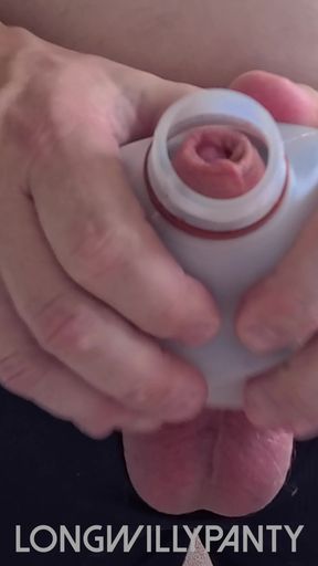 Straight guy sticks his uncut cock in a milk bottle