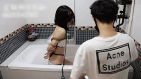 GG47 - A fair-skinned girl wearing sexy lingerie is bound with ropes in a bathtub and subjected to water jets.