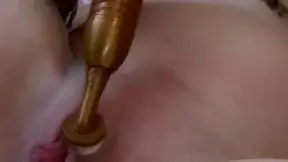 Blonde pregnant Darling playing her pussy using a gold vibrator