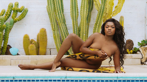 BBW black beautiful babe Aziza exposes her big natural boobs by the pool outdoor