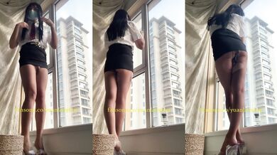 Chinese ladyboy wears black stockings and squirts in front of the floor-to-ceiling window