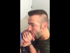 Hunk gives blowjob in a public restroom - amateur gay porn