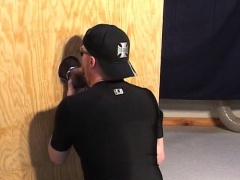 Butch gay dude gets on his knees to blow a rod in a glory hole