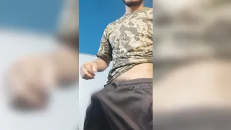 Muscular army hunk strokes his thick uncut cock and shoots a creamy load