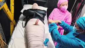 Mistress dominates mummified patient with medical sounding