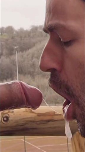 A Guy Gives a Blowjob to a Guy with a Big Cock Outdoors Until He Gives Him a Good Facial