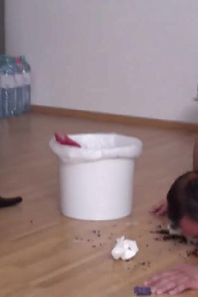 Pouring the rubbish for him to clean it up with his mouth