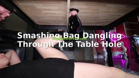 Dangling His Little Punching Bag Dangling From The Milking Table
