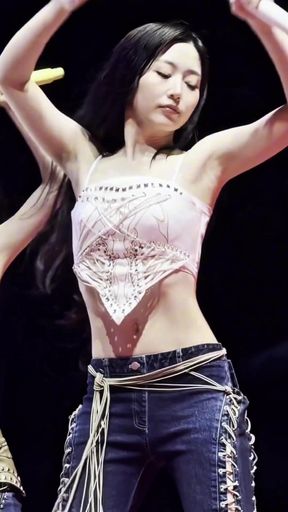 Curvy Asian girl shows off her belly button in a K-pop style