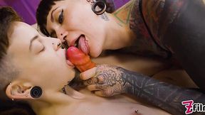 Two inked hotties shove different sex toys in each other's wet pussies