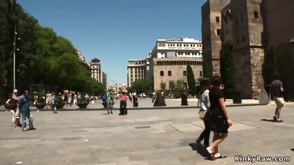 Shackled naked slut posing in public