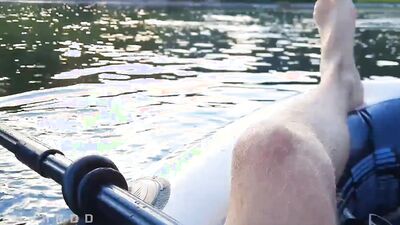 Guy on a boat in the wild masturbates dick and cums powerfully