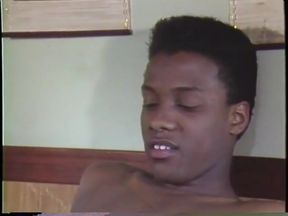 Black man shoves dildo up white man's ass in vintage threesome