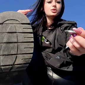 Dirty boot soles for you! Dominatrix Nika is smoking on the beach and you have to lick her dirty boot soles. Boot fetish