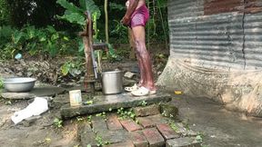 Black mature man bath in desi style. Showing big dick.