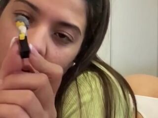Cute giantess plays with her small toys