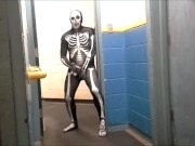skeleton with hard on jerks off in gym hall