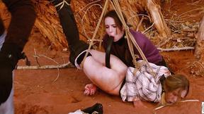 ”Degrading butt to mouth for two girls tied to tree outdoors”