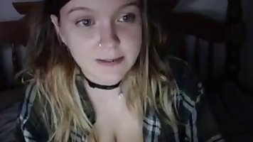 Horny teen babe is showing her very big tits, while in front of the webcam