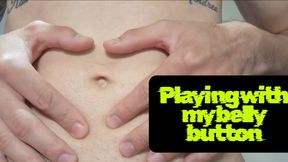 Playing with my belly button