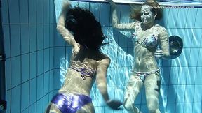 Hovering naked bodies of sexy babes under the water