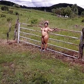 Devska walks completely naked by the country while cars go by