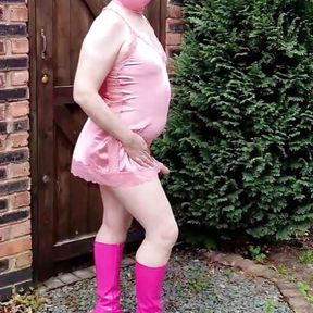 Masked TV sissy slut in hot pink satin and boots outdoors