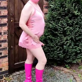 Masked TV sissy slut in hot pink satin and boots outdoors