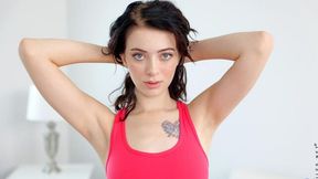 Slender brunette Corra Cox nicely plays with her wet shaved pussy