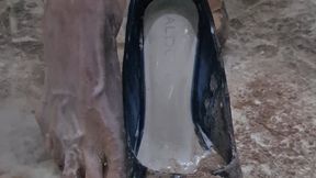 Making a mess in black shiny heels