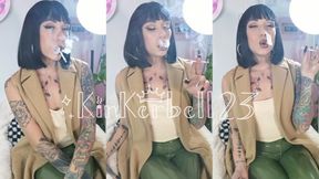 Chain-smoking all White slims in PVC trousers & extra glossy lips