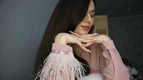 Hands with long nails under the chin