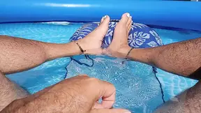 Showing off my wet feet in the pool