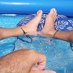 Showing off my wet feet in the pool