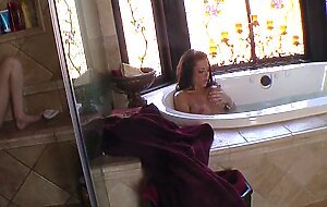 Lesbians Faye Reagan and Victoria Valentino are using sex toys in bath.