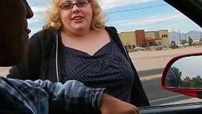 Blonde BBW wench with pale skin is giving a head in front of the camera