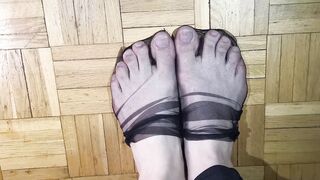 Toes dancing in black nylons