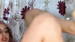 Arab with hijab on stretches using anal dildos