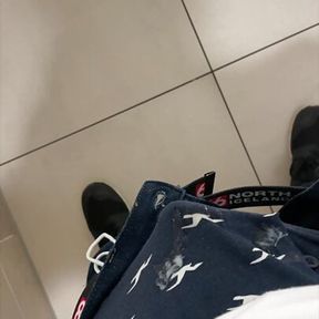 boy is wanking in mall stall bathroom